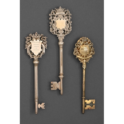 424 - One George V silver gilt and two George V silver ceremonial keys, variously inscribed, 14.8-16.7cm l... 