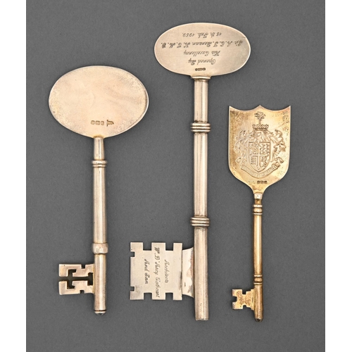 427 - An Edwardian silver ceremonial key, an Elizabeth II silver ceremonial key and a Zambian silver examp... 