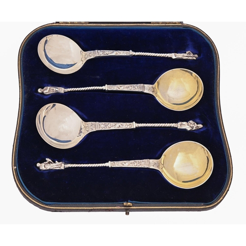 429 - A set of four Victorian silver serving spoons, with spiral stem and apostle finial, by Charles Edwar... 