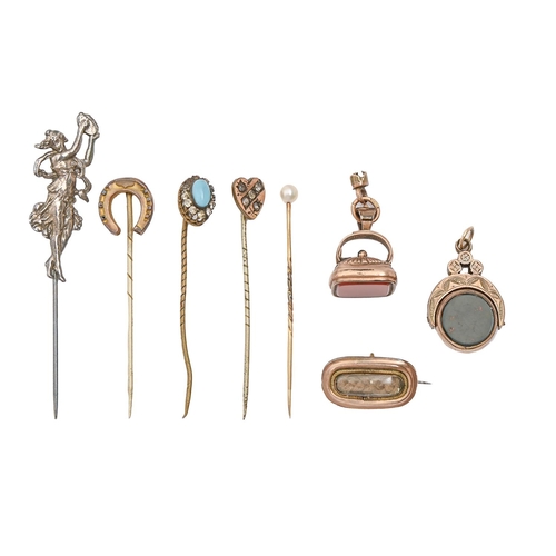54 - A gold mourning brooch, fob seal, fob swivel and several stickpins, 19th c and later, 18g... 