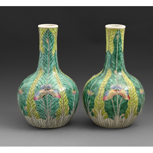 601 - A pair of Chinese famille rose vases, 20th c, of bottle shape painted with flowers and crickets on a... 