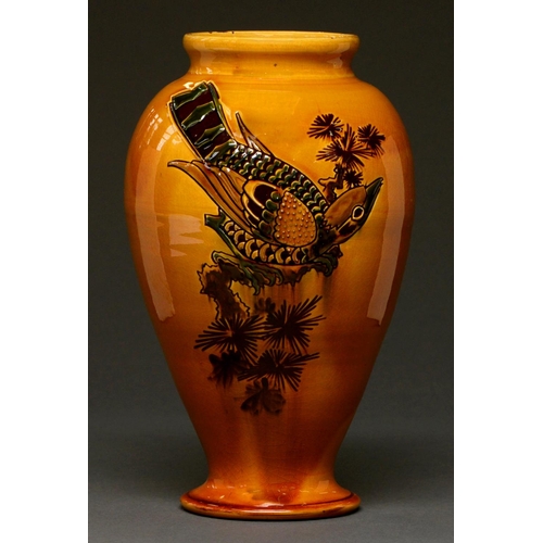 618 - A C H Brannam slipware vase, early 20th c, decorated with a bird on a branch on ochre glaze, 26cm h,... 