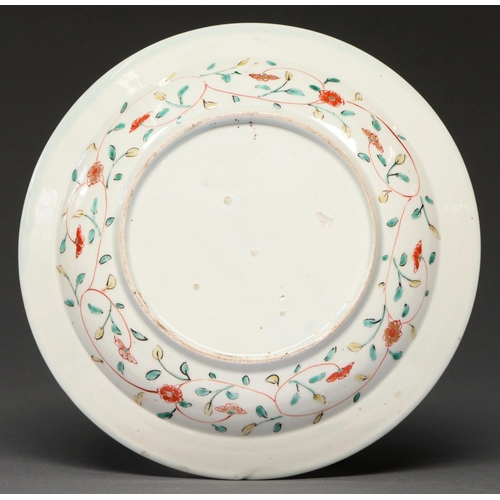 619 - A Japanese Imari dish, Edo period, 18th c, enamelled to the centre with a flower filled vessel in pr... 