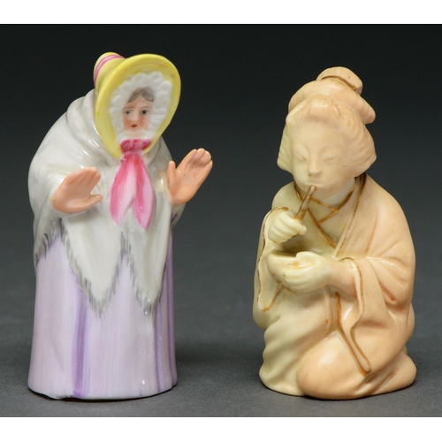 639 - Two Royal Worcester figural candle snuffers, in the form of a Japanese girl and Granny Snow, early 2... 