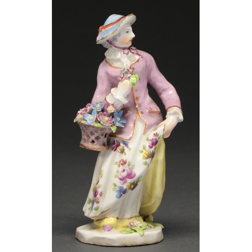 646 - A Bow figure of a flower seller, 1750-55, a basket of flowers at her elbow, wearing a ribbon-tied ha... 