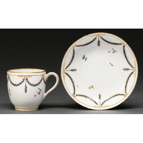 651 - A Derby coffee cup and saucer, c1770-1777, enamelled in black and grey with husk festoons and polych... 