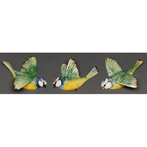 652 - A graduated set of three Beswick flying blue tit wall plaques, 11cm and smaller, printed mark... 