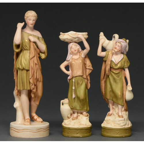 656 - One and a pair of Royal Dux figures of Eastern water carriers and a classical maiden, early 20th c, ... 