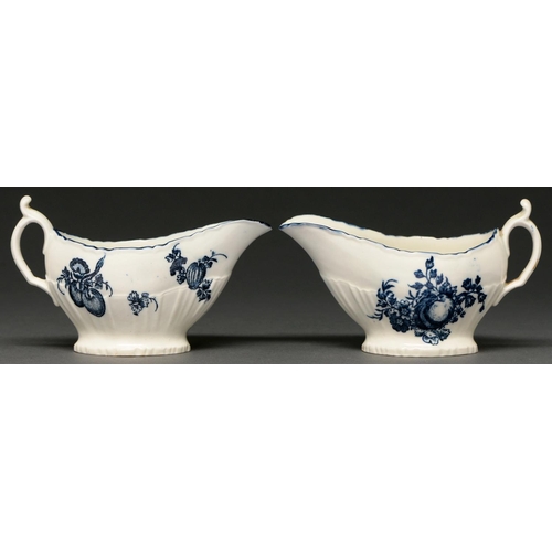 663 - A pair of Caughley blue and white shell-moulded sauceboats, 1777-1784, transfer printed with the App... 