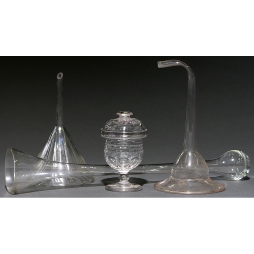 701 - A Victorian cut glass sugar bowl and domed cover, 15cm h, a blown glass funnel, possibly 18th c, wit... 