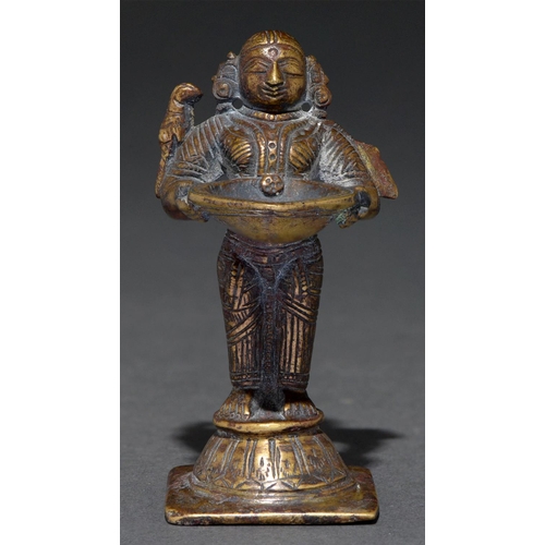 765 - A miniature brass figural votive lamp, South India, 19th / early 20th c, in the form of Lakshmi, 88m... 