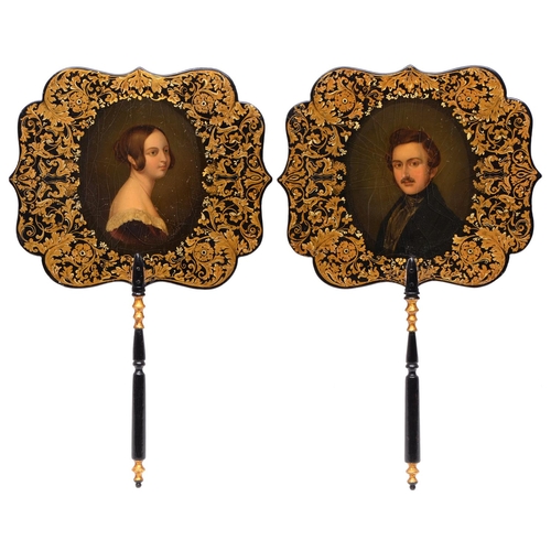 780 - A pair of Victorian royal portrait papier mache hand screens, c1840, painted with Queen Victoria and... 