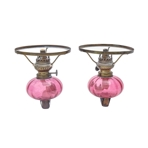 807 - A pair of brass mounted cranberry glass peg lamps, late 19th c, 16cm h