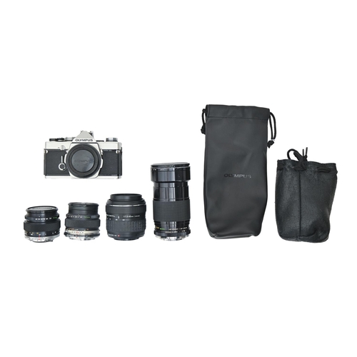 836 - An Olympus OM-I 35mm camera, two Olympus camera lenses, comprising F1.4 50mm and F3.5 50mm, an Olymp... 