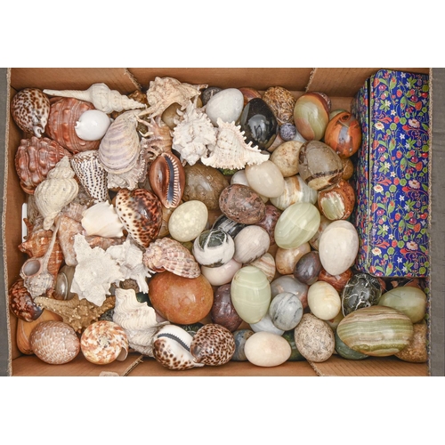 861 - A collection of ornamental mineral eggs and seashells