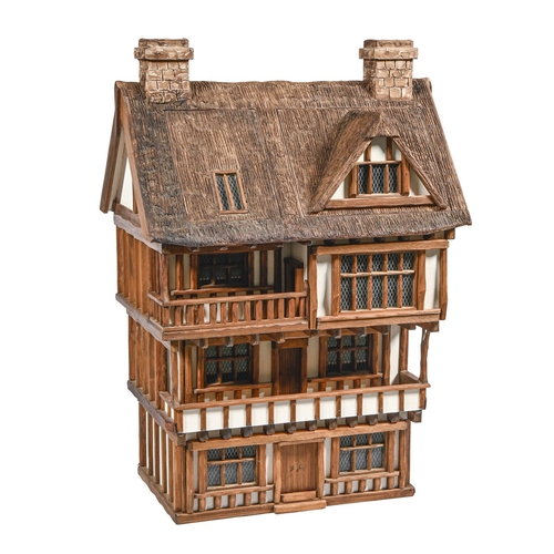 896 - A Robert Stubbs Tudor style doll's house, recent manufacture, 116cm h