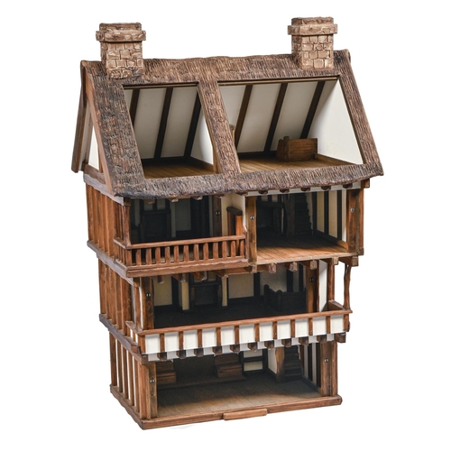 896 - A Robert Stubbs Tudor style doll's house, recent manufacture, 116cm h