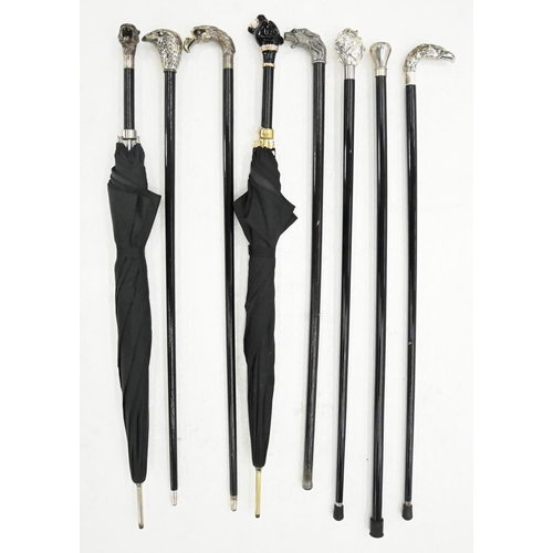 907 - Eight decorative reproduction canes and umbrellas, with silvered resin or other handle ... 