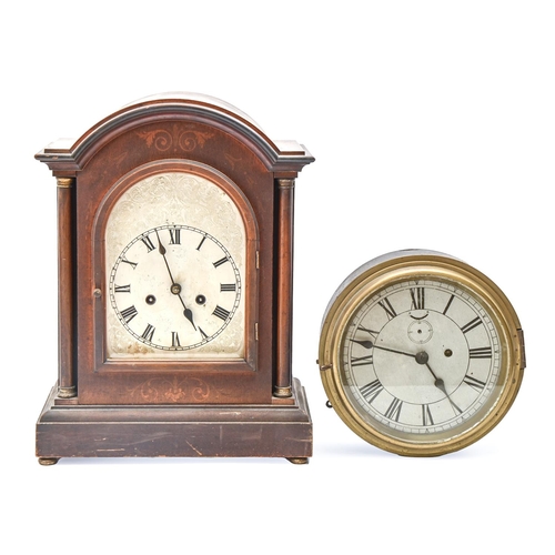 943 - A German mahogany-stained and inlaid breakarched mantel clock, c1900, with pillars and silvered dial... 