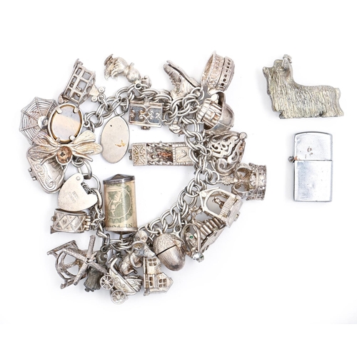 95 - A silver charm bracelet, 16cm l, 3ozs 13dwts and two other items, including a miniature metal cigare... 