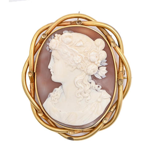 96 - A cameo brooch, late 19th c, the oval shell carved with Flora, in entwined giltmetal mount, 70mm... 