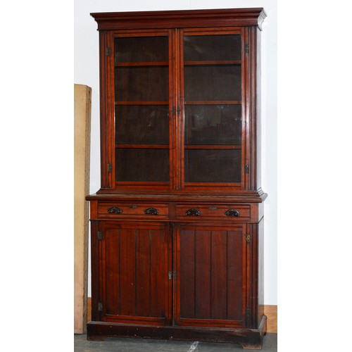 1211 - An Edwardian mahogany bookcase, the lower part with drawers with replacement bakelite handles above ... 