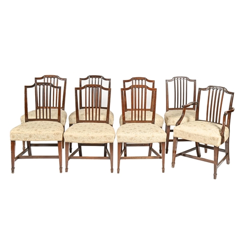 1203 - A set of eight Regency mahogany dining chairs, including a pair of elbow chairs, carved with paterae... 