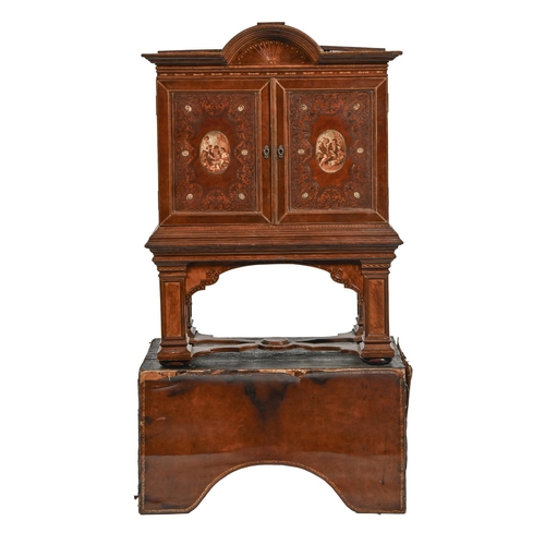 1212 - A Spanish tooled leather writing cabinet, c1920, with breakarched pediment and fitted interior with ... 