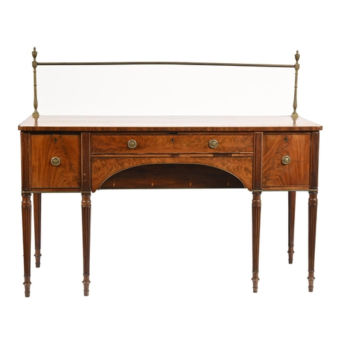 1214 - A Regency mahogany sideboard, crossbanded in ebony and line inlaid, with brass rail, arched drawer t... 