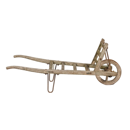 1157 - A wood and iron sack barrow, early 20th c, the single wheel with iron tyre, 150cm l