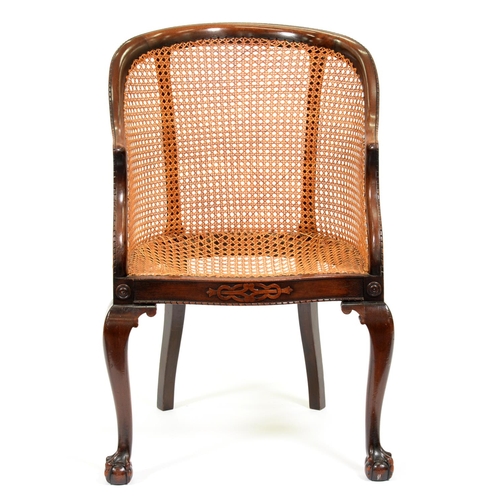 1215 - A mahogany-stained beech and caned bergere, early 20th c, on cabriole legs