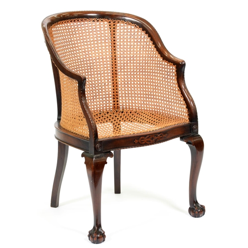 1215 - A mahogany-stained beech and caned bergere, early 20th c, on cabriole legs