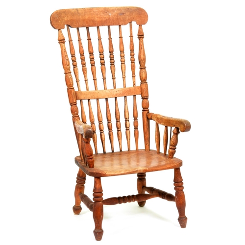 1216 - A Victorian ash spindle back chair, with elm seat, on turned legs retaining traces of red stain... 