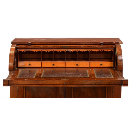 1220 - A Victorian mahogany bureau, with cylinder front and sliding interior above panelled doors, 94cm h; ... 