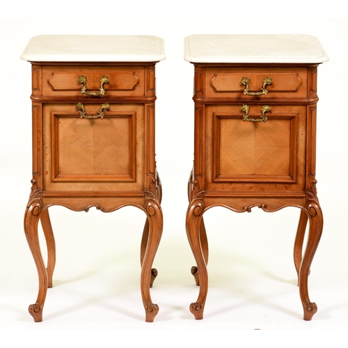 1235 - A pair of French walnut pot cupboards, early 20th c, with brass loop handles, marble slab, 79cm h; 3... 