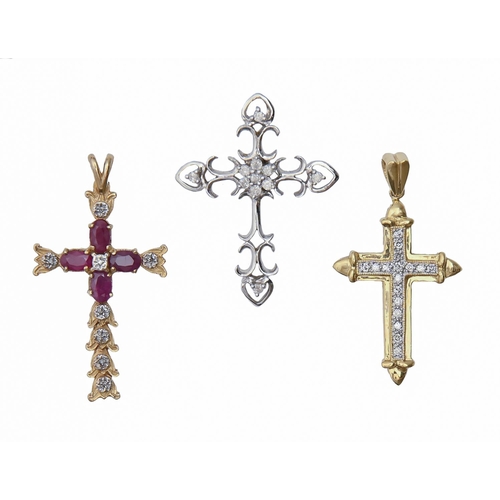 125 - One white gold and two gold crosses, variously gem set, largest 38mm, 10.7g