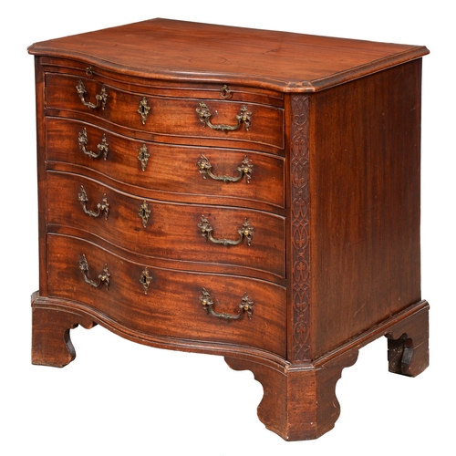 1324 - A George III serpentine mahogany chest of drawers, the top with moulded lip and angles above brushin... 