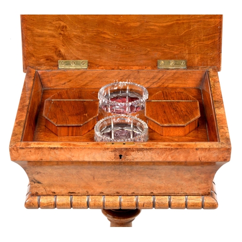 1329 - A Victorian walnut and burr walnut teapoy, of sarcophagus shape, the lid in matched veneers having f... 