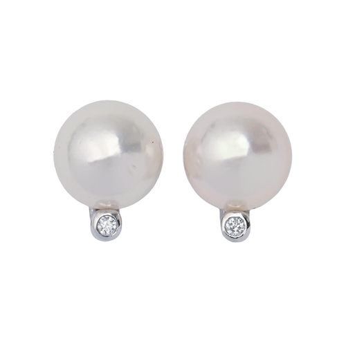 134 - A pair of cultured pearl and diamond ear studs, in 9ct white gold, 11mm, 3.4g