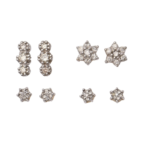 140 - Four pairs of diamond ear studs, in gold, 10cm (three stone ear studs), 4.9g