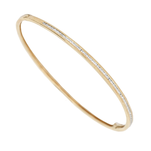 141 - A diamond bangle, in gold, 64mm (internal), marked 750, 8.7g