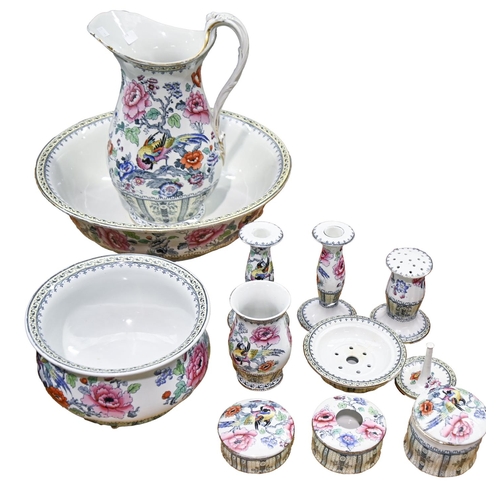 1450 - A Losol Ware toilette service, c. 1900, comprising wash jug and bowl, chamber pot, a pair of candles... 