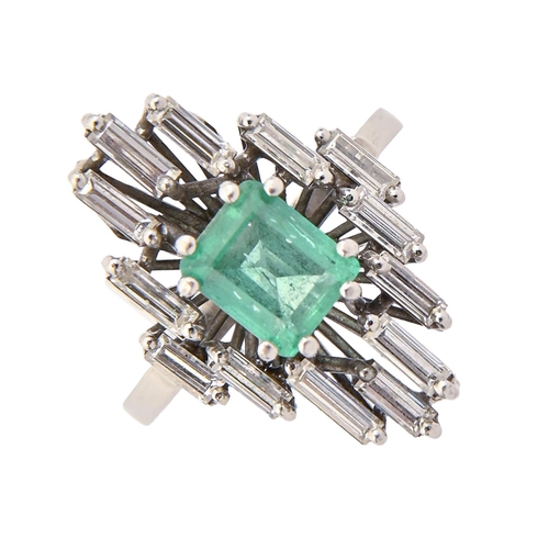 15 - An emerald and diamond ring, the step cut emerald 5 x 6mm, in asymmetrical surround of baguette diam... 