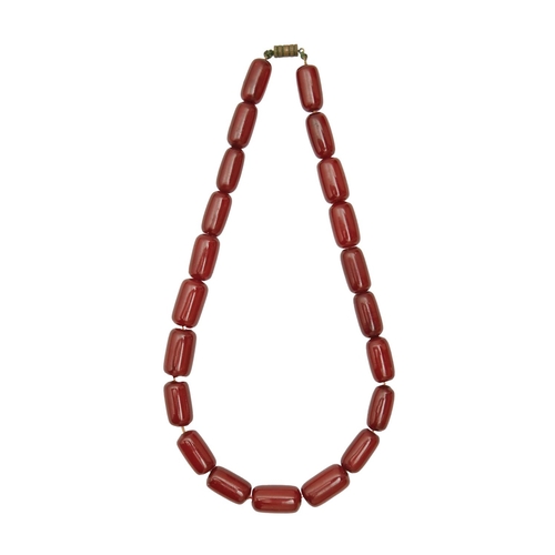 189 - A necklace of oblong faturan beads, 38g