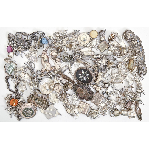 221 - Miscellaneous silver brooches and charms, Victorian and later, several gem set, 18ozs 10dwts... 