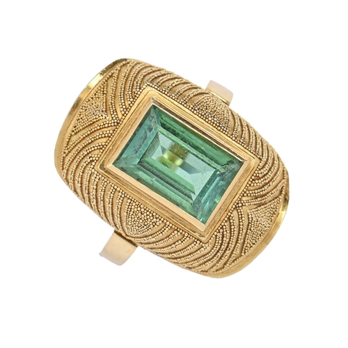 25 - A tourmaline ring, the rectangular step cut green tourmaline in domed and beaded setting, in gold, s... 