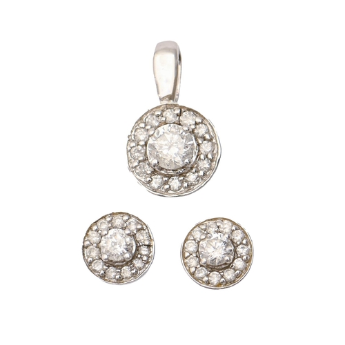 38 - A diamond cluster pendant and matching ear studs, in white gold, pendant cluster 8mm diam, marked 37... 
