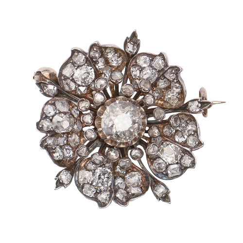 42 - A Belle Epoque diamond brooch, c1900, designed as a flower, with round and cushion shaped old cut di... 