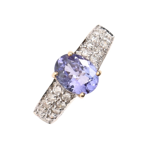 51 - A tanzanite and diamond ring, in 18ct gold, marks obscured, 5.2g, size Q