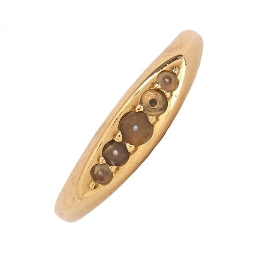 64 - A split pearl ring, in gold marked 18, 3.2g, size N